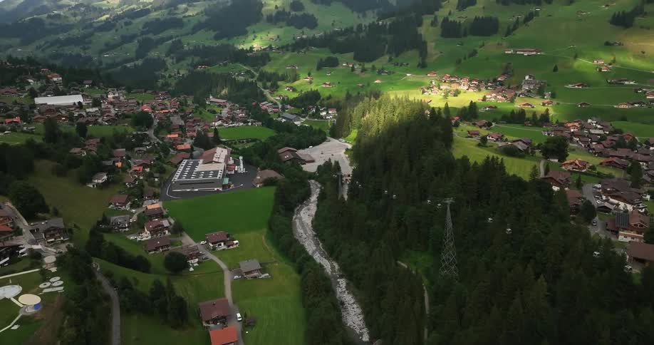 Aerial view of a small european town on a valley in the mountains at daytime