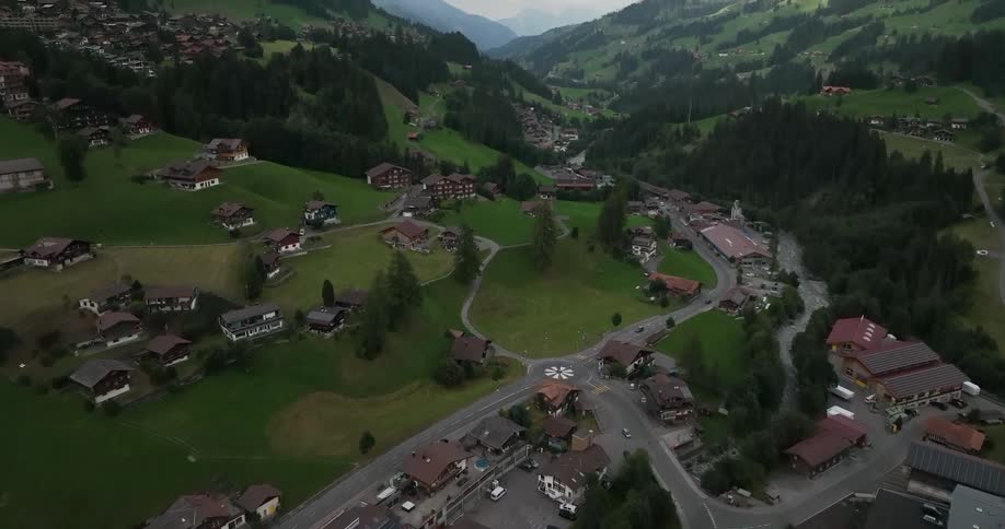 Aerial view of a small european town on a valley in the mountains at daytime