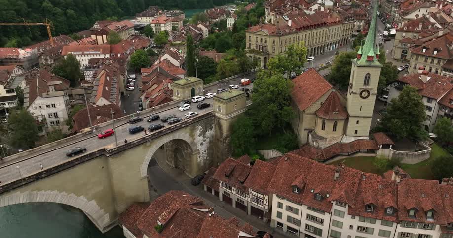 Cars travel on the bridge through town