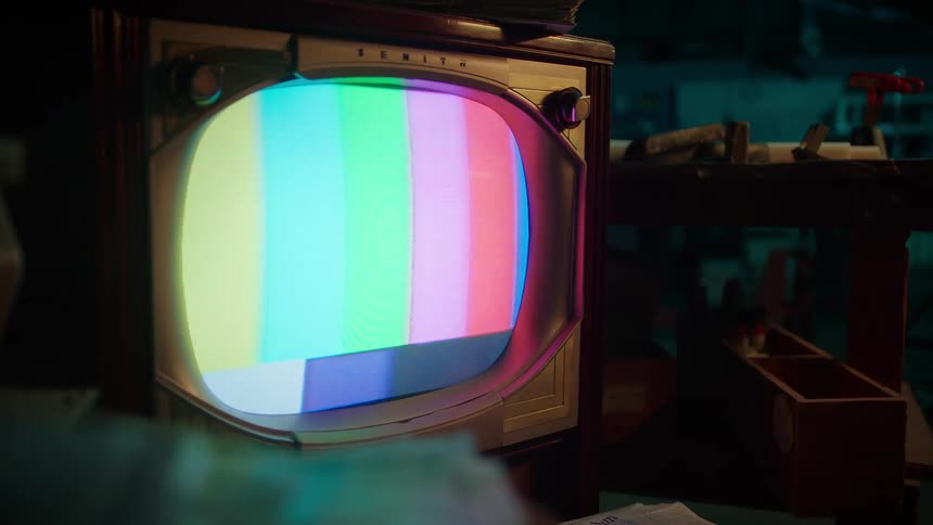 Static plays on a vintage television before shutting off