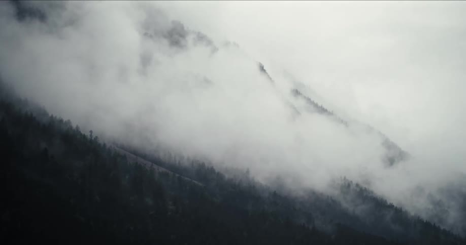 Heavy clouds cover the mountain