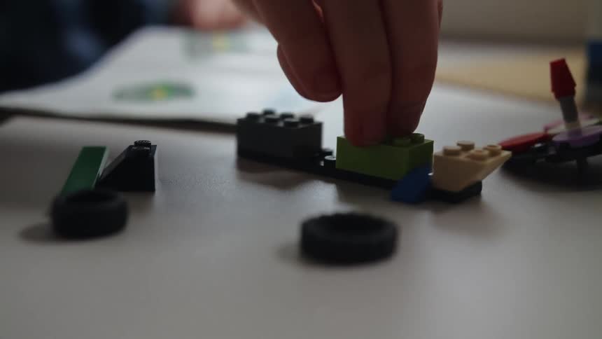 A child plays with lego