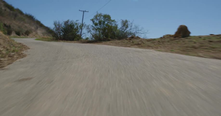 Point of view footage climbing up a path or small road uphill on a mountain
