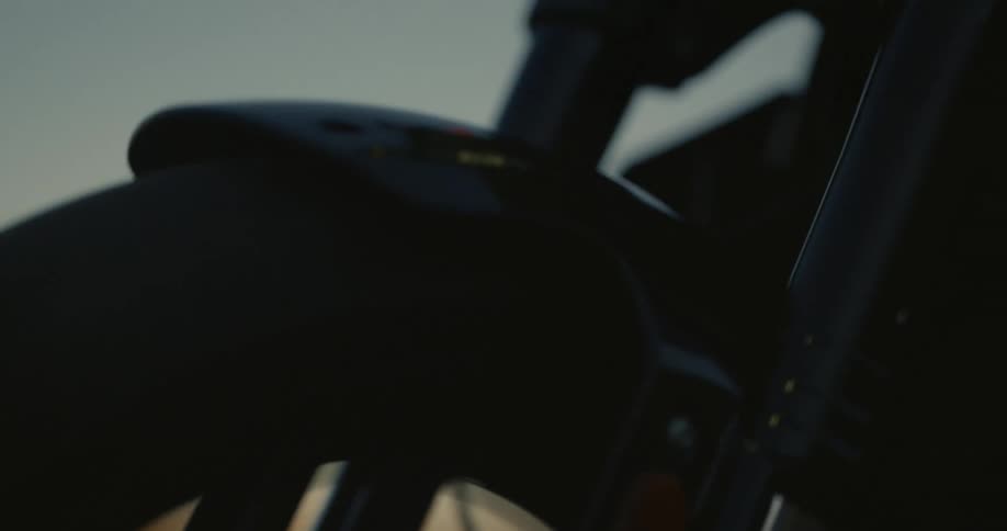The front wheel and headlight of a motorcycle vibrate as it is driven