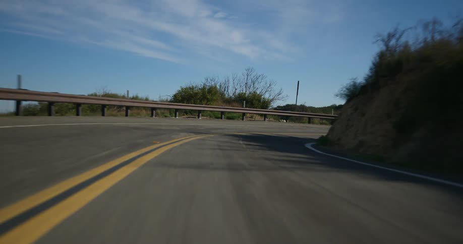 Vehicle drives on mountain highway