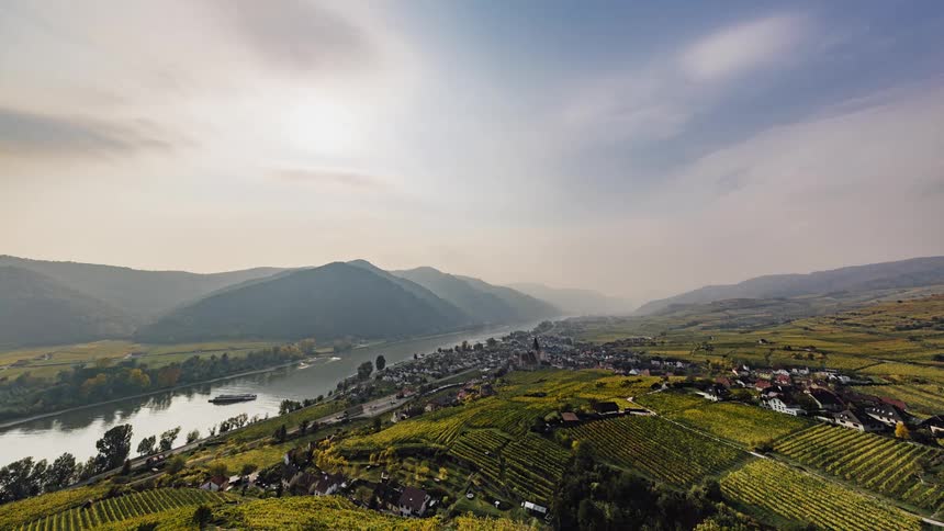 Aerial view of town near river and farmlands