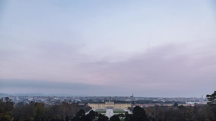 Time lapse of clouds rolling over an european city at evening