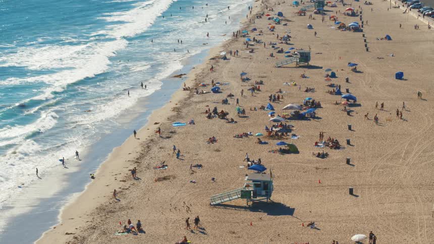 Beach on a sunny summer day full of people