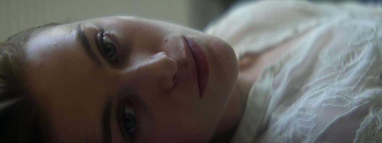 Pretty young woman lying down