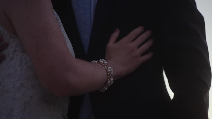 A husband and wife are hugging