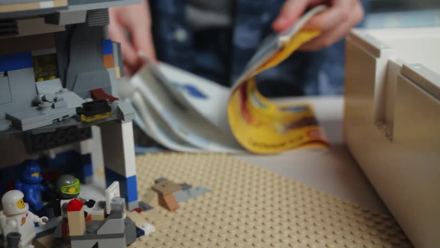 A child opens a box of legos