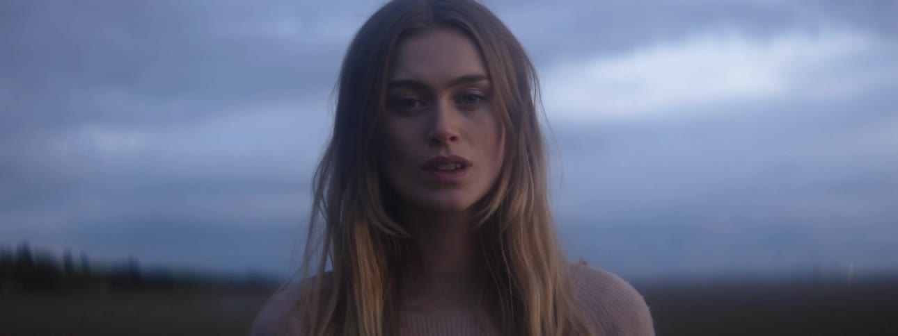 Face of a young beautiful woman opening her eyes