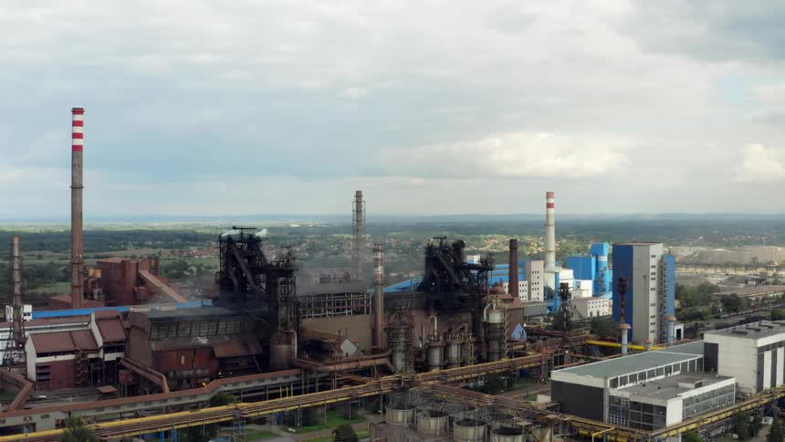 A large Eastern European refinery under a cloudy daytime sky
