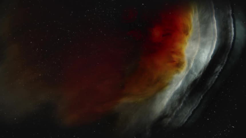 Blob of white and dark red ink floating over a black background