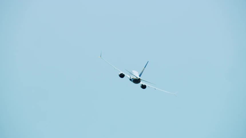 Passenger 737-Max airplane departing the airport as seen from 10,000 feet
