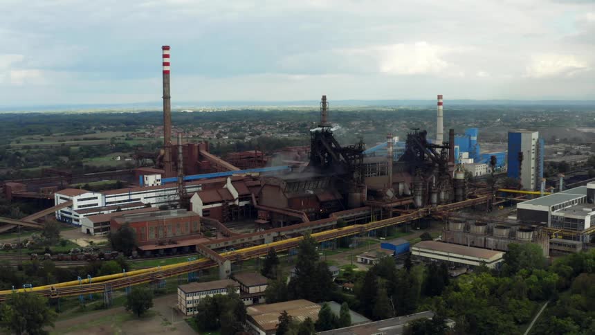 A large factory complex under a cloudy daytime sky in Belgrade, Serbia