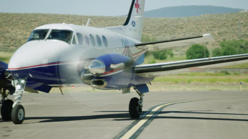 A medevac Beechcraft King Air life flight twin engine aircraft taxis for take off
