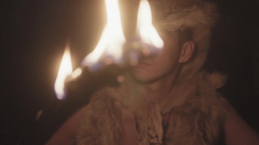 Man wearing a fox fur over his head