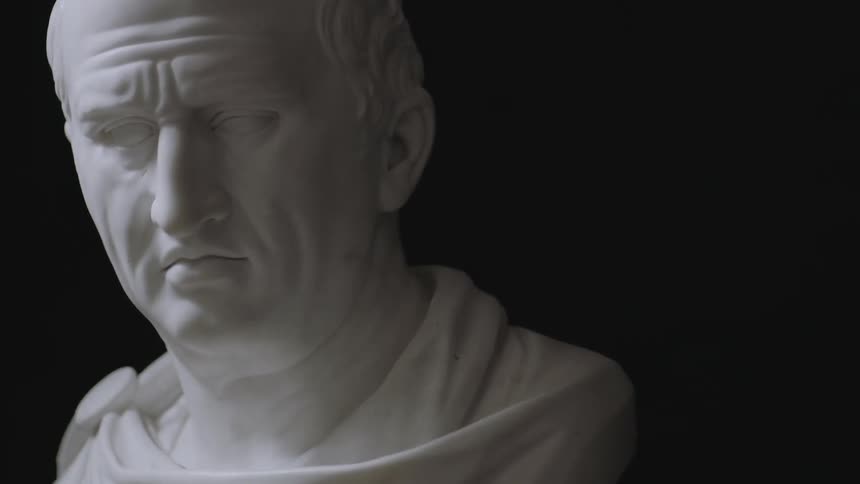 A bust of a man's head comes into focus