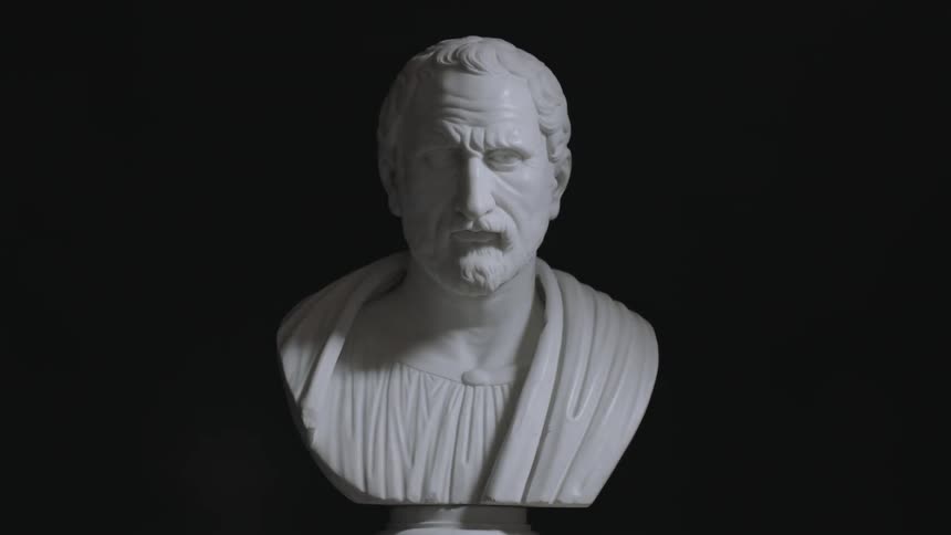 A stone carved bust of a man