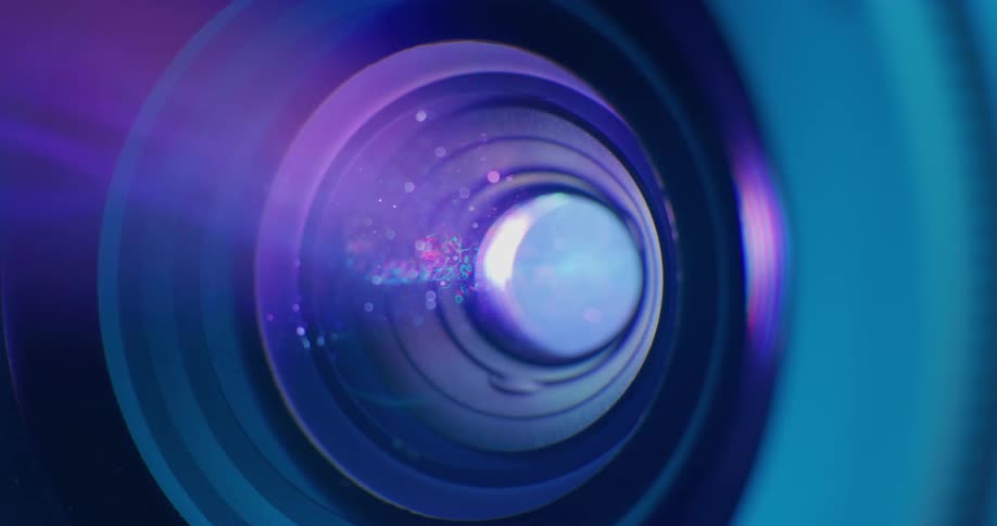 Mist and droplets of water on a lens with light shining through