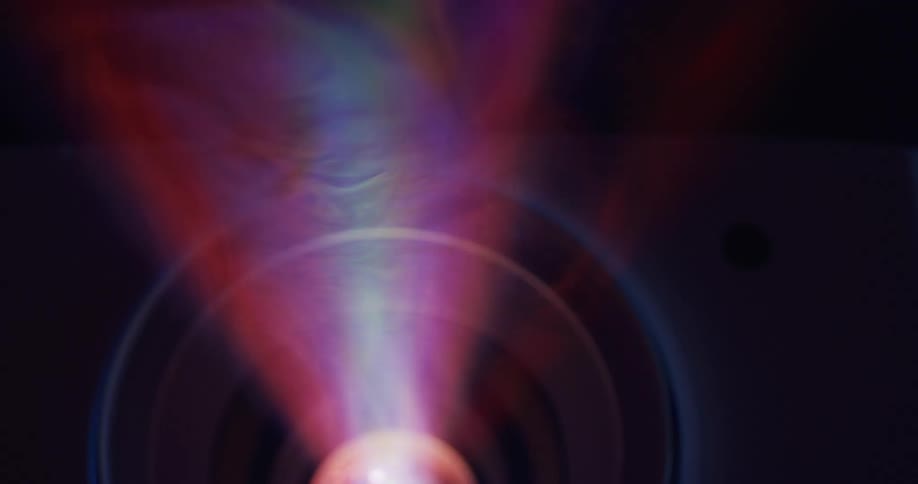 Neon lights shine out of a projector