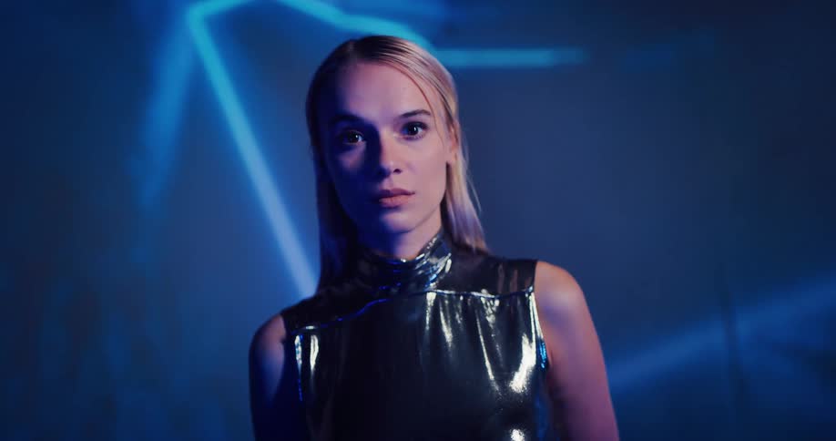 A portrait of a woman is displayed with flare lights