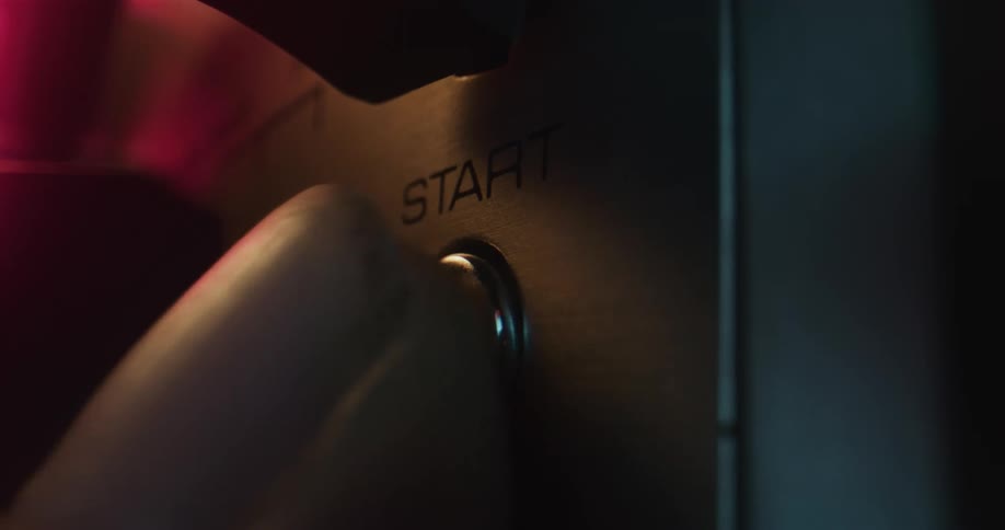 A person pushing a button on a machine