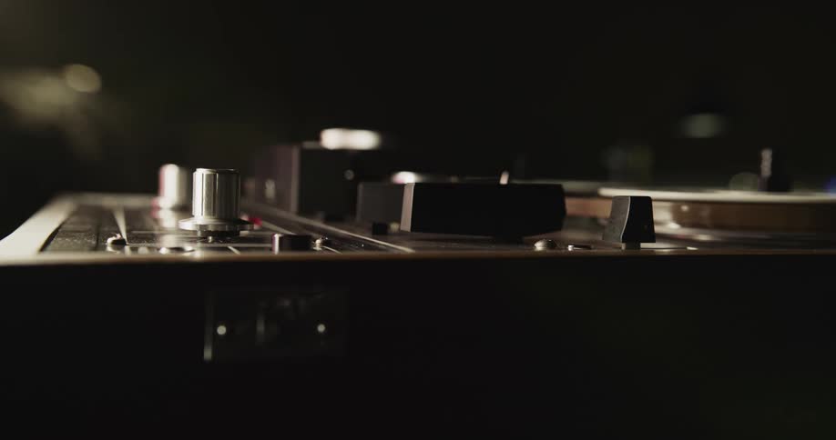 A view of a person turning on knobs