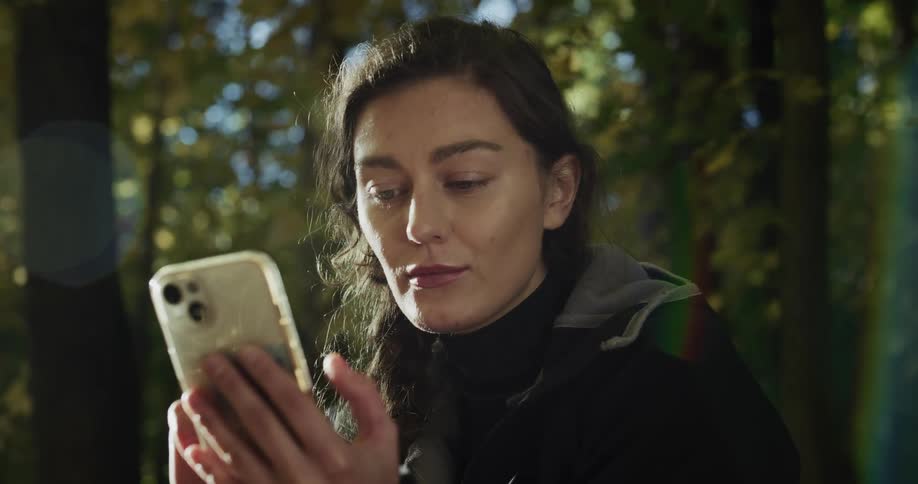 A woman using a smartphone outdoors