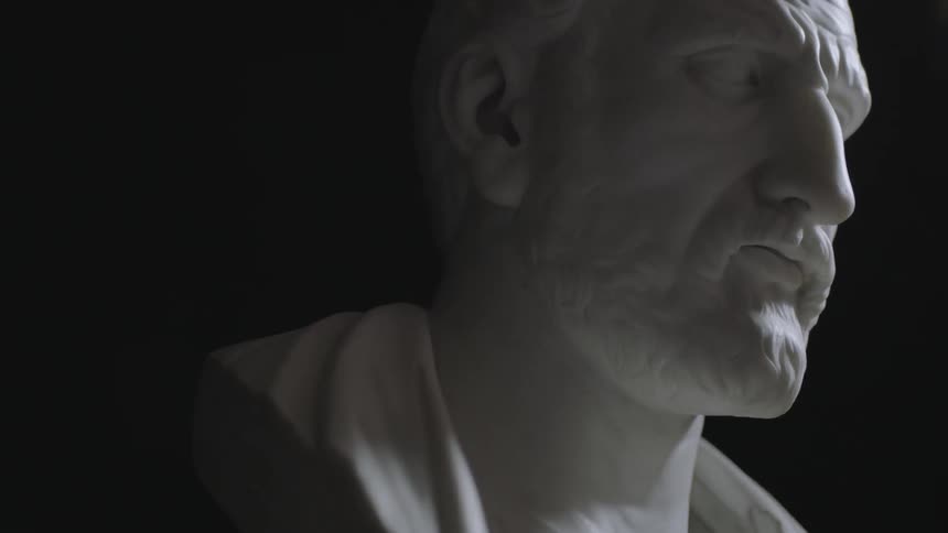 A finely detailed stone statue of a man