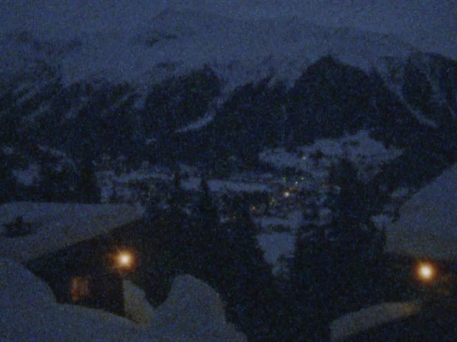 Footage of mountains during winter is displayed