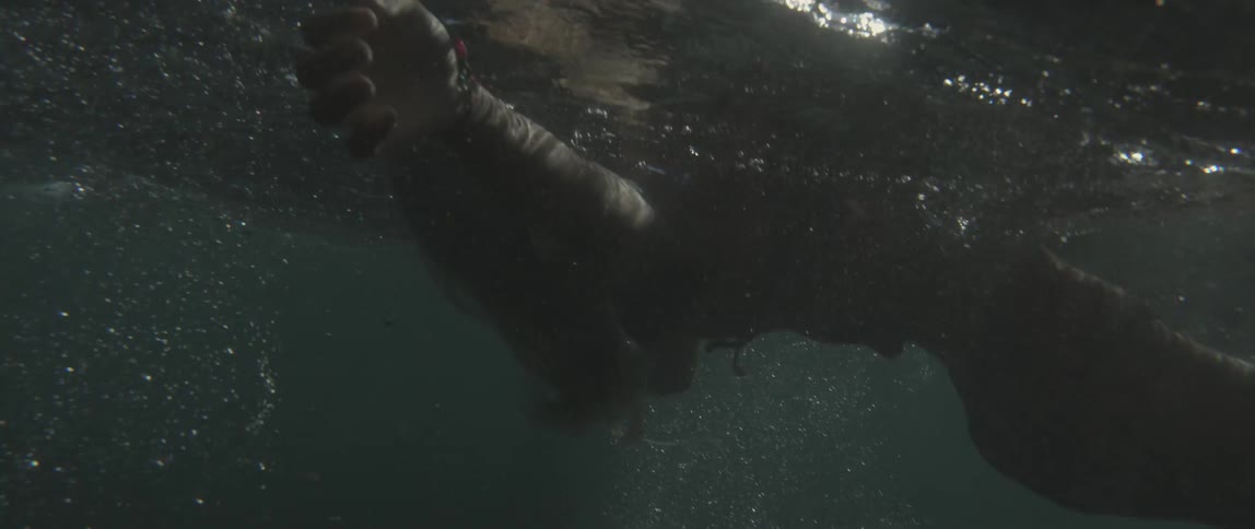 Underwater shot of a woman floating on her back