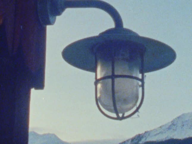 An outdoor light being turned on
