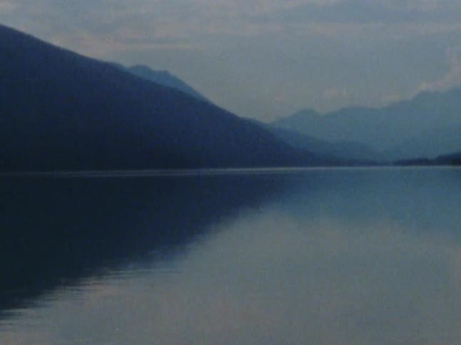 A calm mountain lake in the daytime