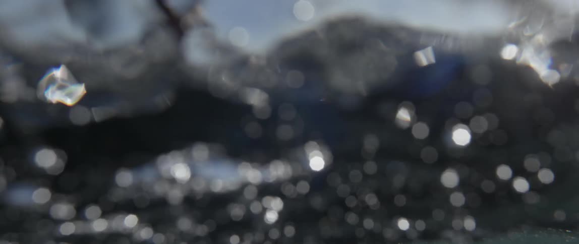 Underwater  shot of a woman slowly stroking the water while swimming
