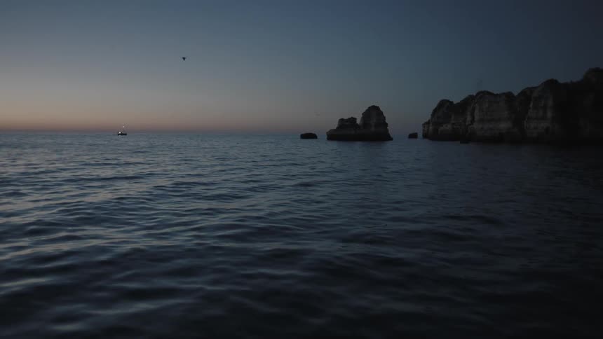 Rocks in the ocean at sunset