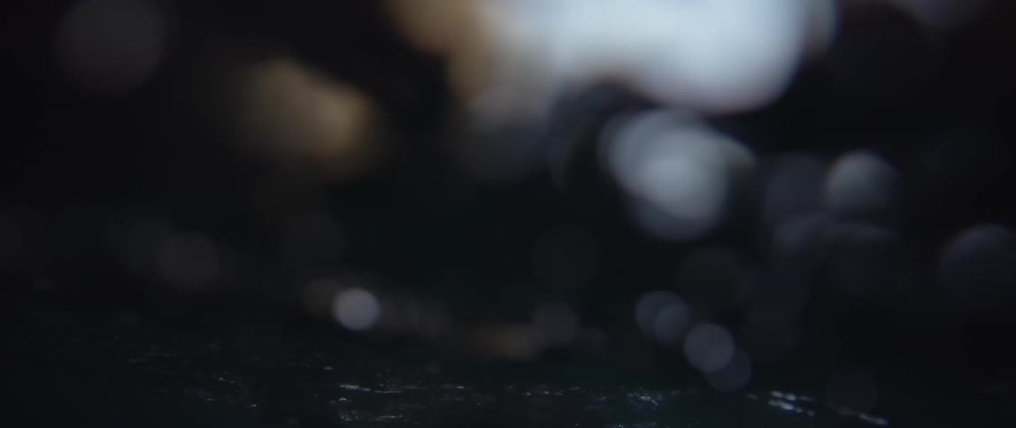 Person floating in a watery cavern