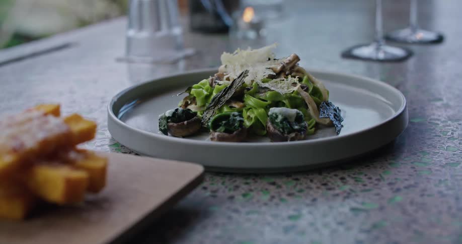 Close up of a dish of salad served on a table at a restaurant