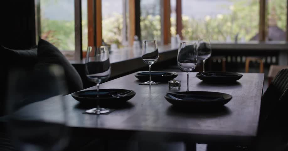 Tableware over a table on an empty restaurant at morning