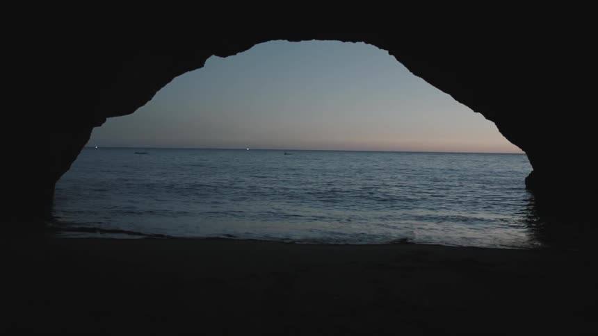 View of the ocean as seen from inside a cave
