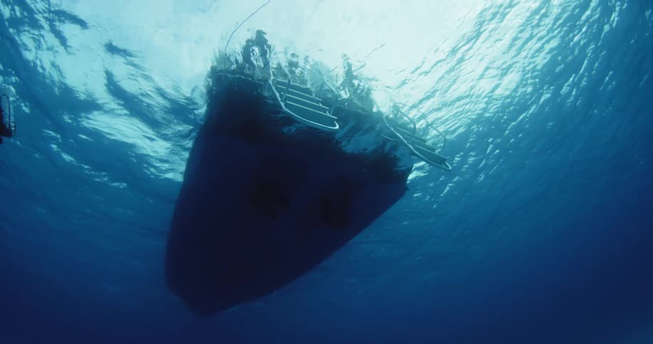 A boat travels in the water above