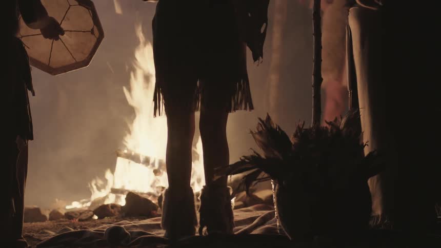 People gather around a campfire