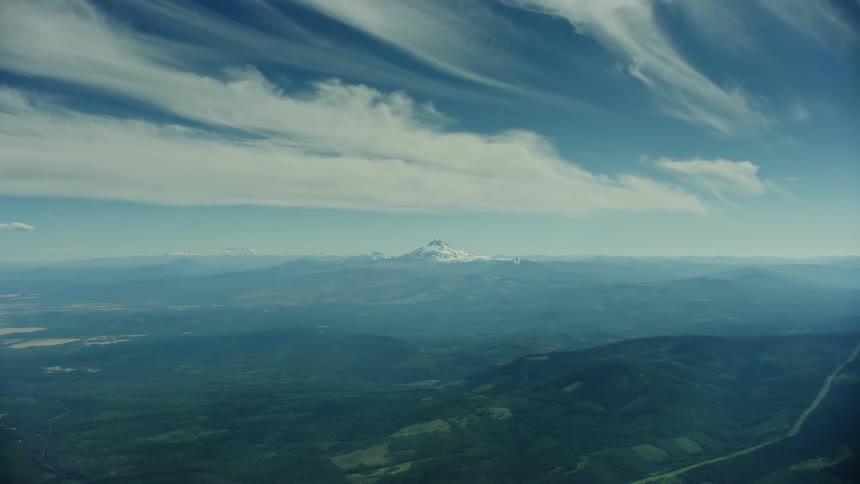 Hyperlapse flying at 10,000 feet directly towards Mount Jefferson watching the clouds shift and move about as the airplane covers hundreds of miles flying through the mountains