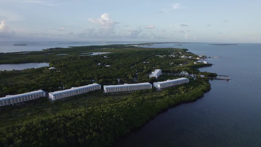 An aerial view of large buildings on a coastline