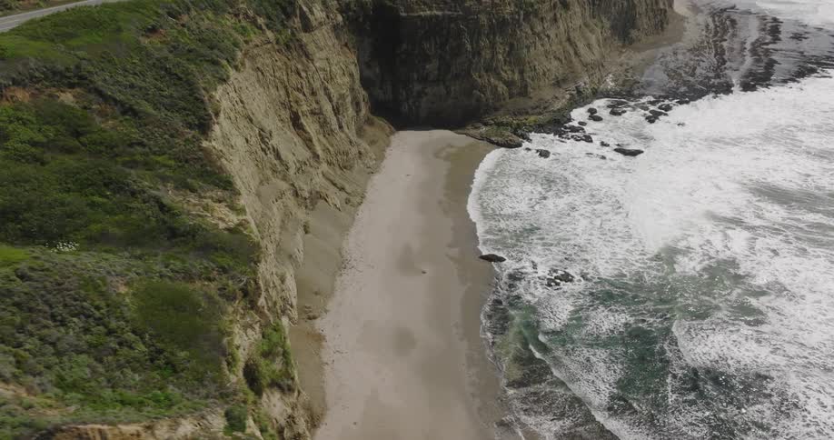 Aerial view of birds flying above the ocean is displayed