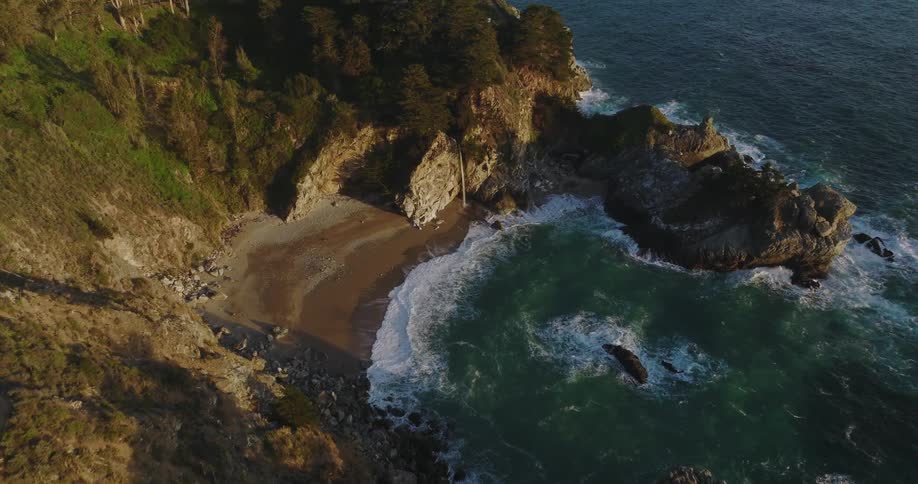 The tide washes into a small cove during the day