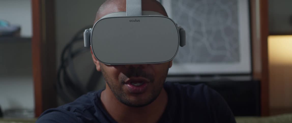 A man is playing a virtual reality game indoors
