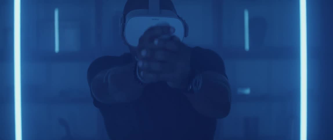 A man is playing a virtual reality video game
