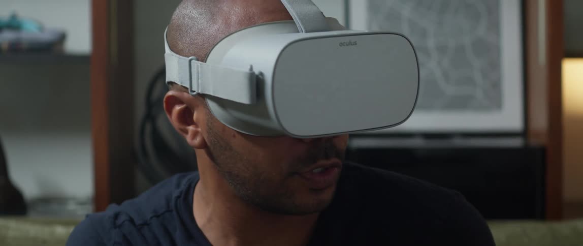 A man is playing a game with his virtual reality headset